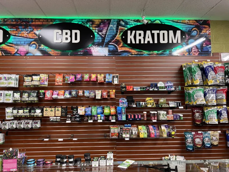 The CBD and Kratom product section at GS Vape Barberton, offering lab-tested wellness options for Summit County customers. CBD and Kratom product wall display at GS Vape Barberton, Ohio