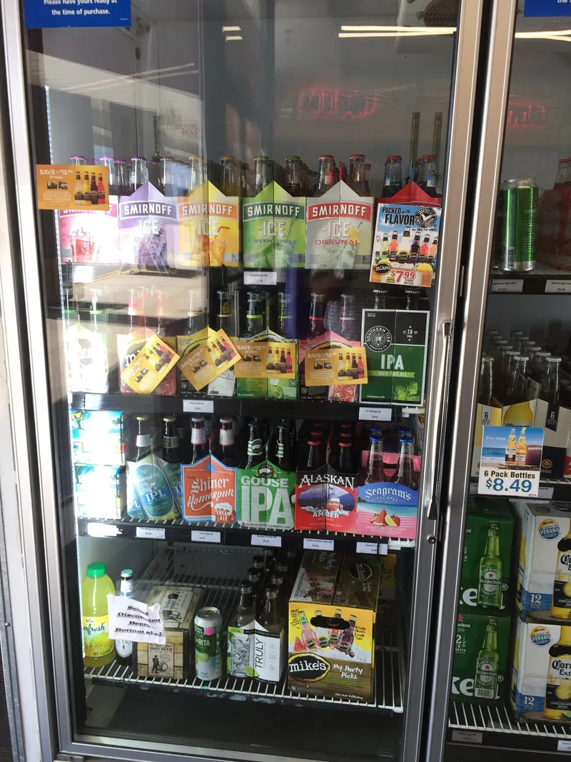 A close-up of the craft beer and IPA cooler selection available at GS Vape Barberton, Ohio. Craft beer and IPA selection in a cooler at GS Vape Beer & Tobacco